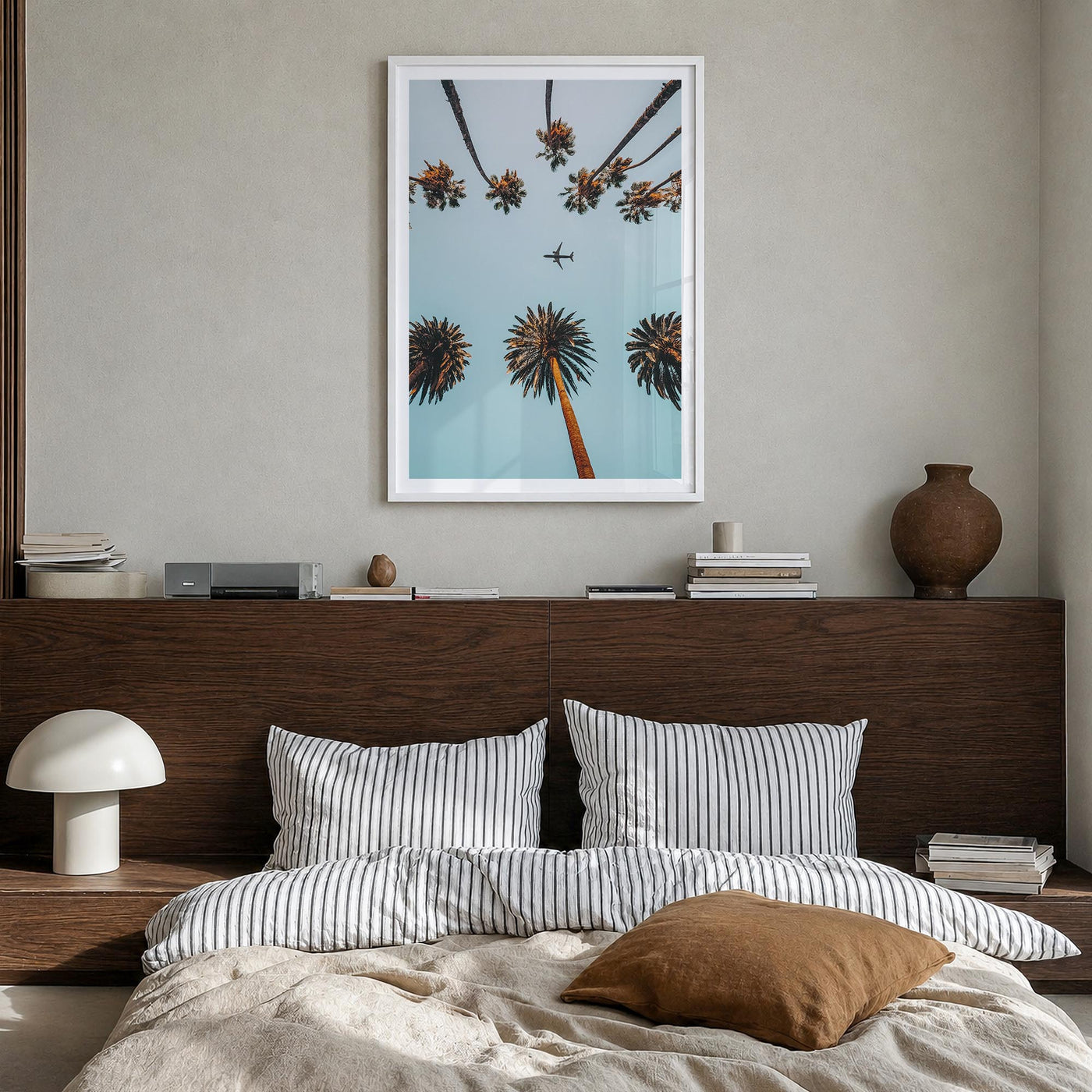 Palm Trees, Sky and Aircraft colorful photo poster – vertical wall art in white wood frame with white border, hanging on wall