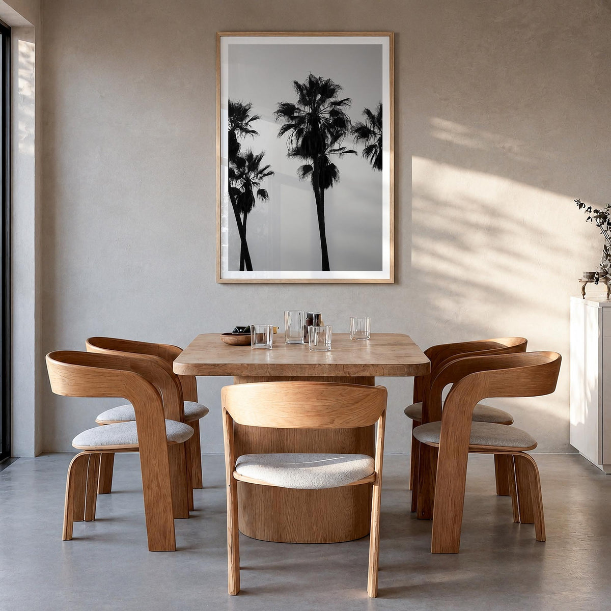 Palms black & white photo poster – vertical wall art in natural wood frame with white border, hanging on wall