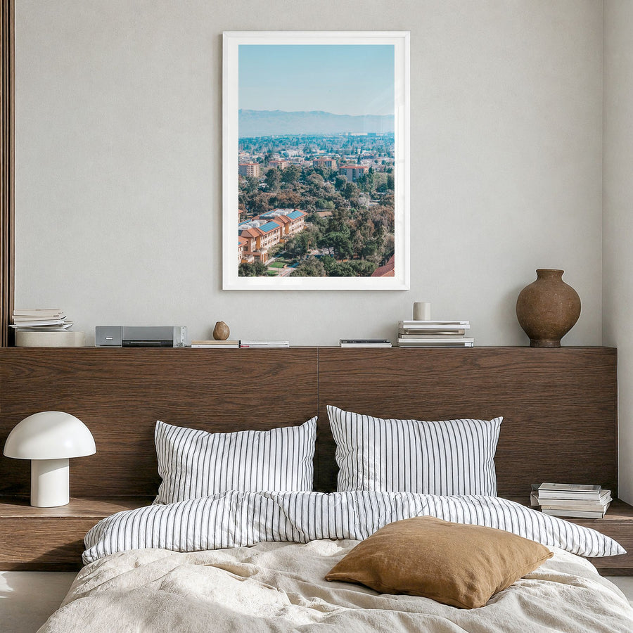 Palo Alto Photo Poster in a white wood frame, hanging in a bedroom, white border