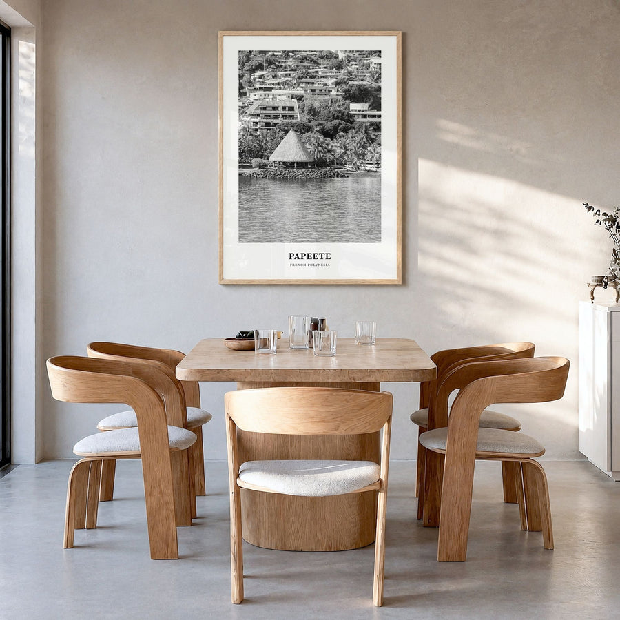 Papeete Classic Poster in a natural wood frame, hanging in a dining room