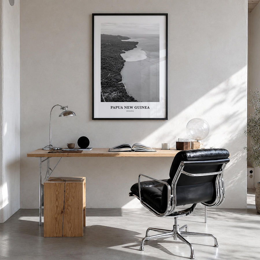 Papua New Guinea black & white classic poster of Oceania – vertical wall art in black wood frame, hanging on wall
