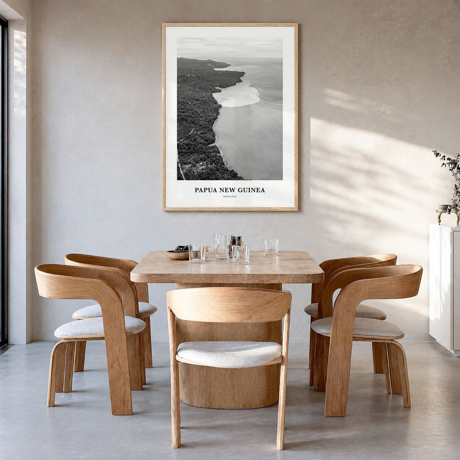 Papua New Guinea Classic Poster in a natural wood frame, hanging in a dining room