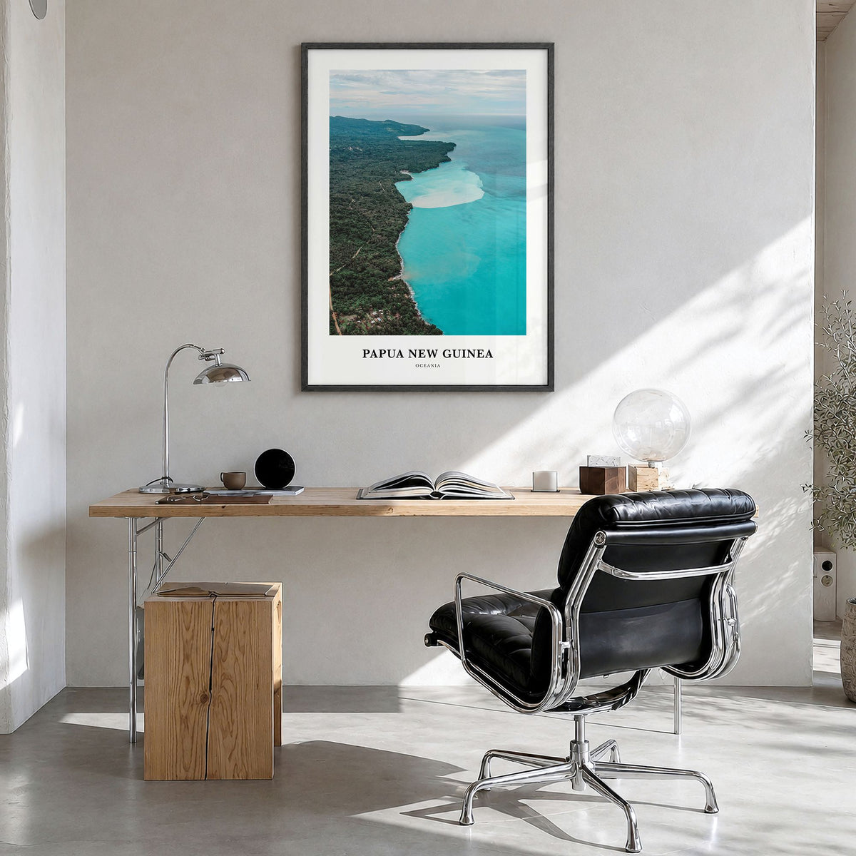 Papua New Guinea Classic Poster in a black wood frame, hanging in a bright home office