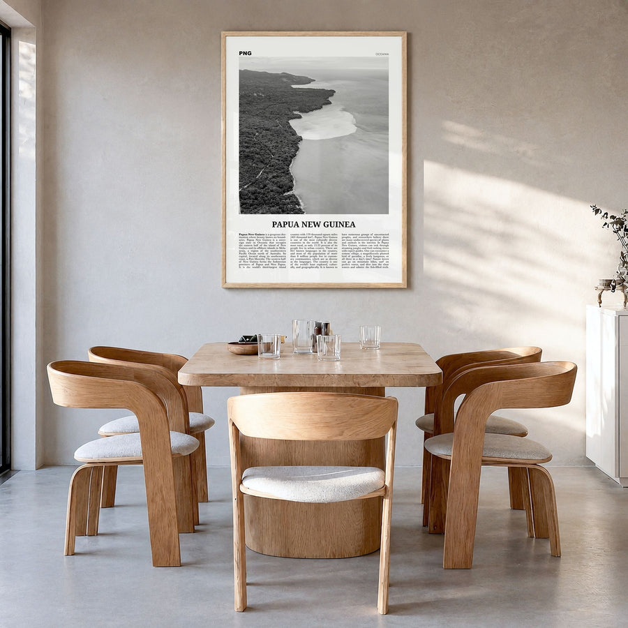 Papua New Guinea Newspaper Poster in a natural wood frame, hanging in a dining room