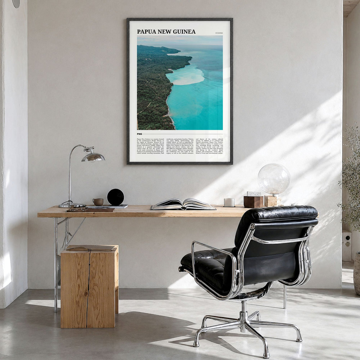 Papua New Guinea Travel Poster in a black wood frame, hanging in a bright home office