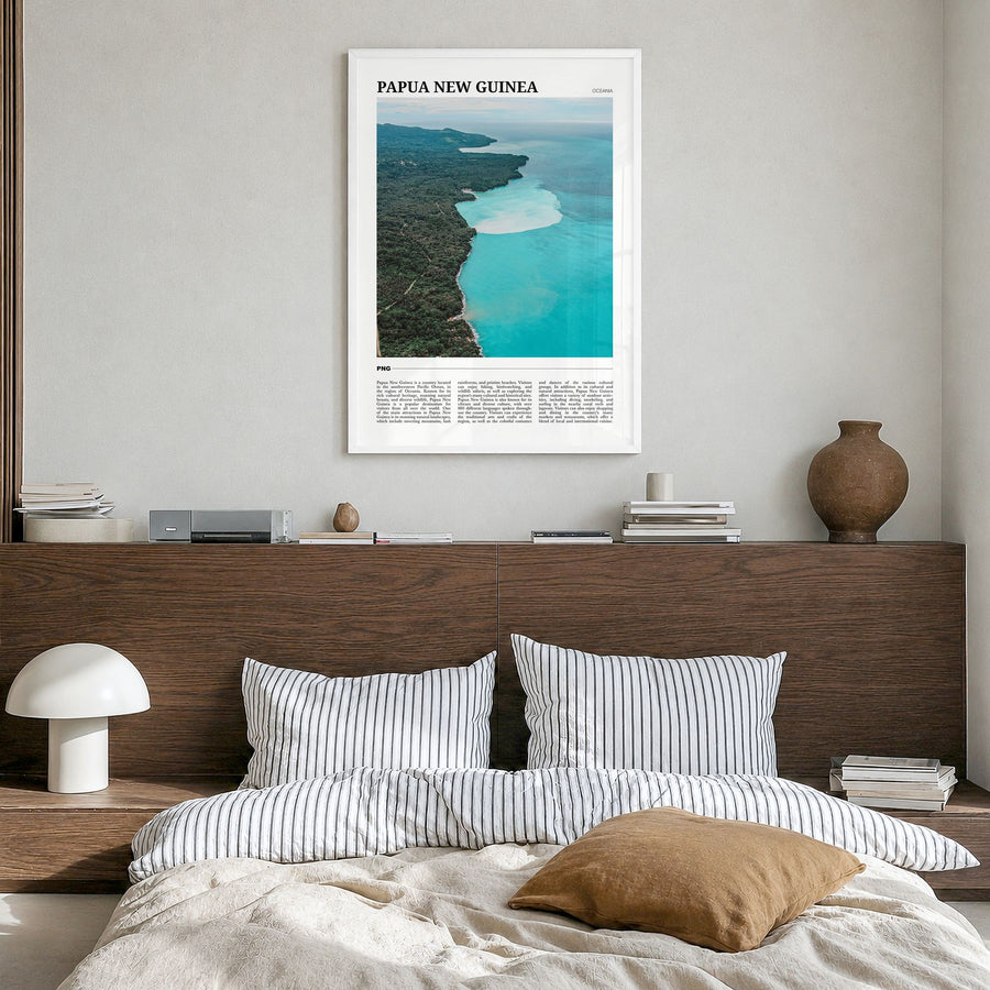 Papua New Guinea Travel Poster in a white wood frame, hanging in a bedroom