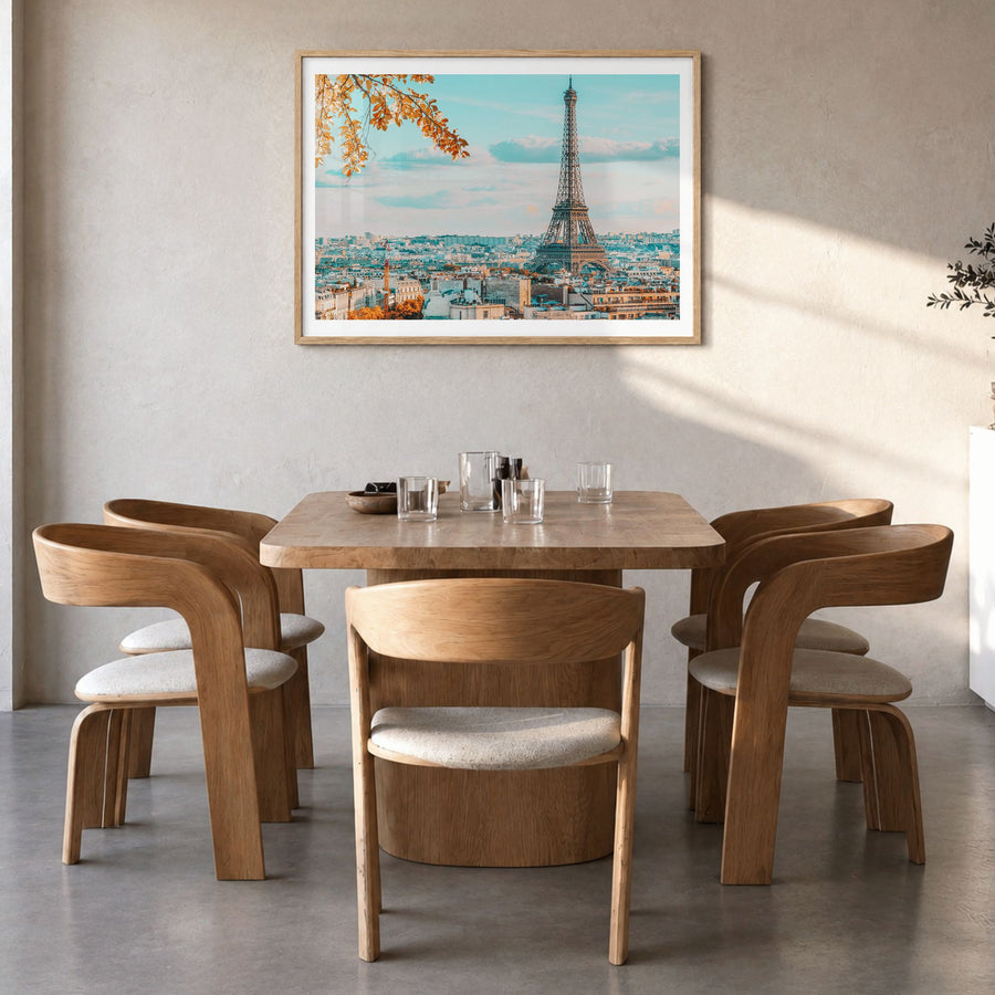 Paris Photo Poster in a natural wood frame, hanging in a dining room, white border