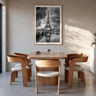 Paris no. 2 black & white photo poster of France – vertical wall art in natural wood frame with white border, hanging on wall