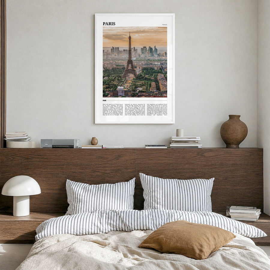 Paris Travel Poster in a white wood frame, hanging in a bedroom