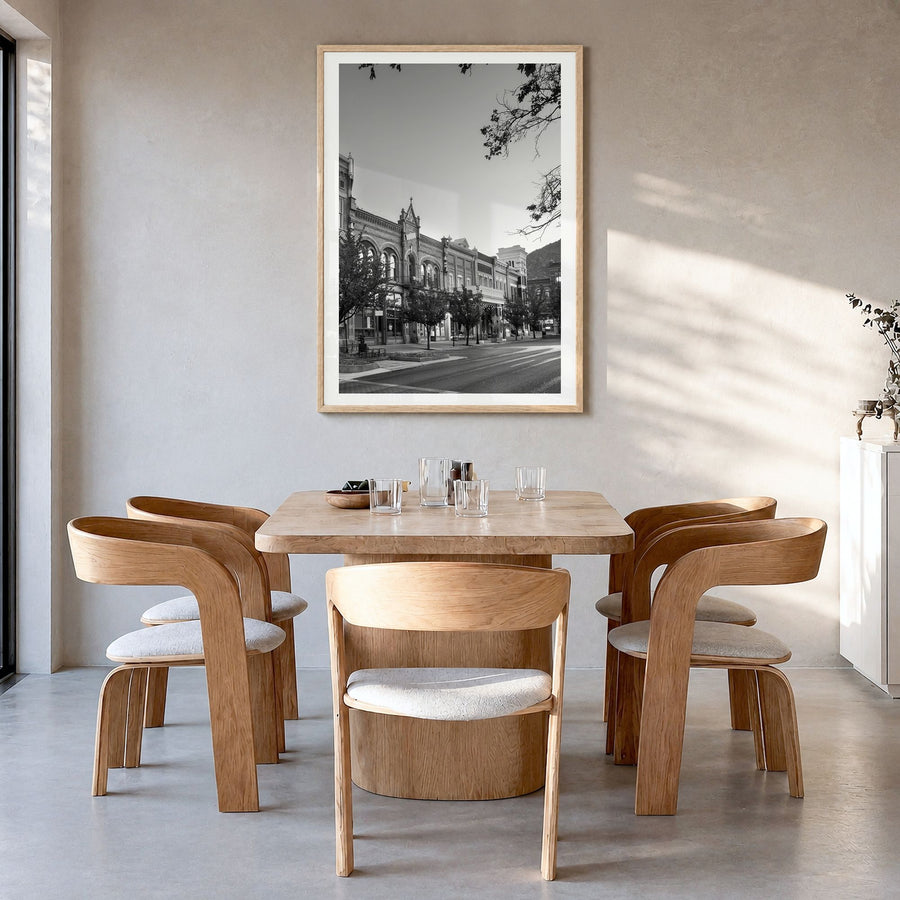 Park City Photo Poster in a natural wood frame, hanging in a dining room, white border