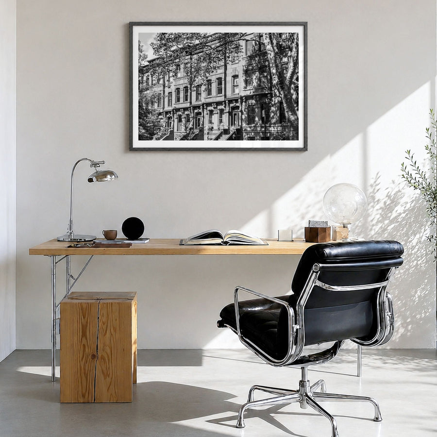 Park Slope Photo Poster in a black wood frame, hanging in a bright home office, white border