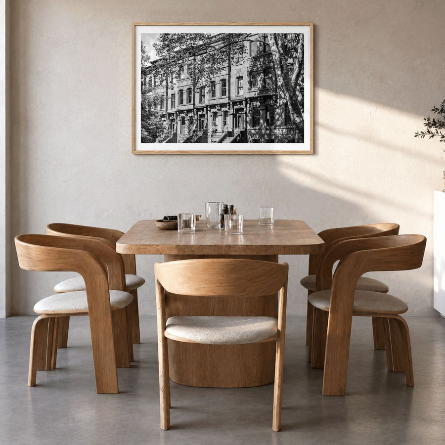 Park Slope Photo Poster in a natural wood frame, hanging in a dining room, white border