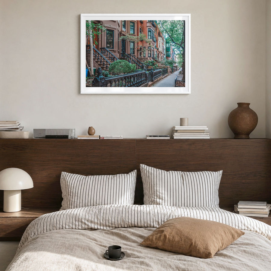 Park Slope Photo Poster in a white wood frame, hanging in a bedroom, white border