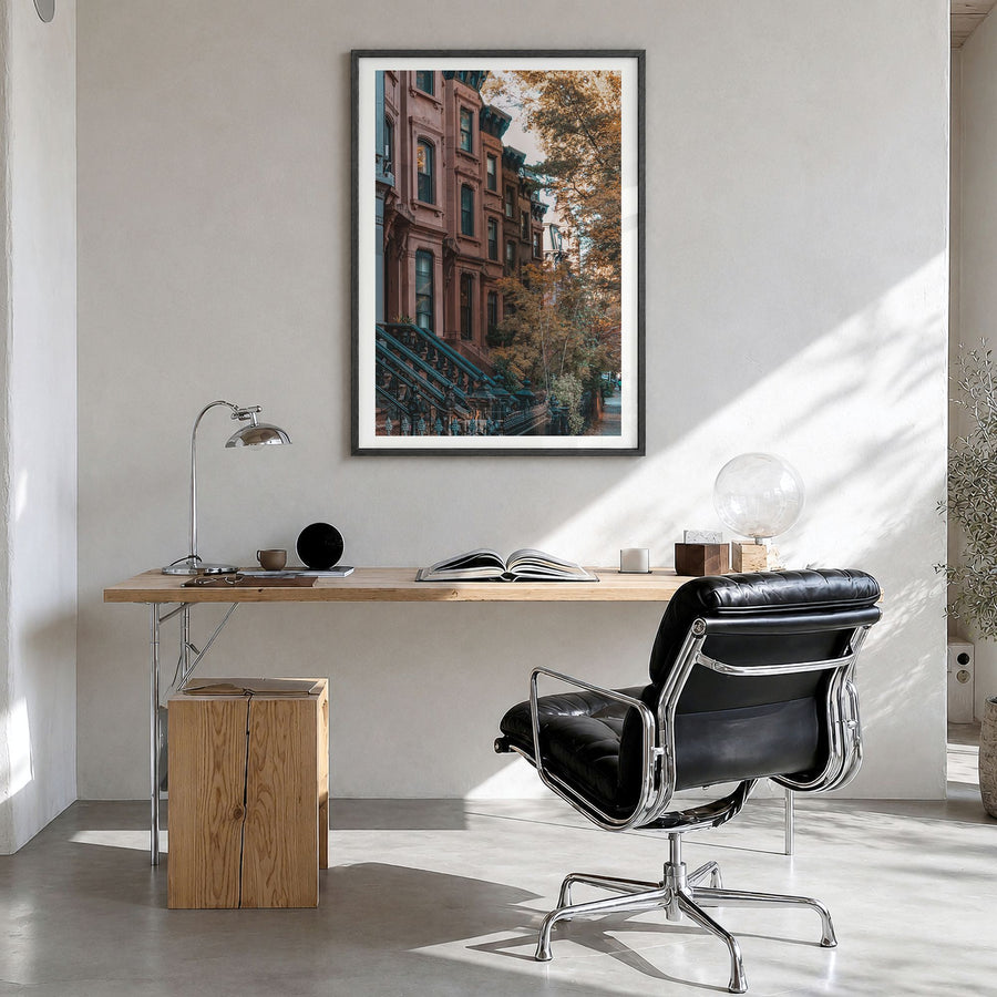 Park Slope Photo Poster in a black wood frame, hanging in a bright home office, white border