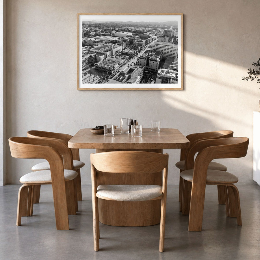 Pasadena Photo Poster in a natural wood frame, hanging in a dining room, white border