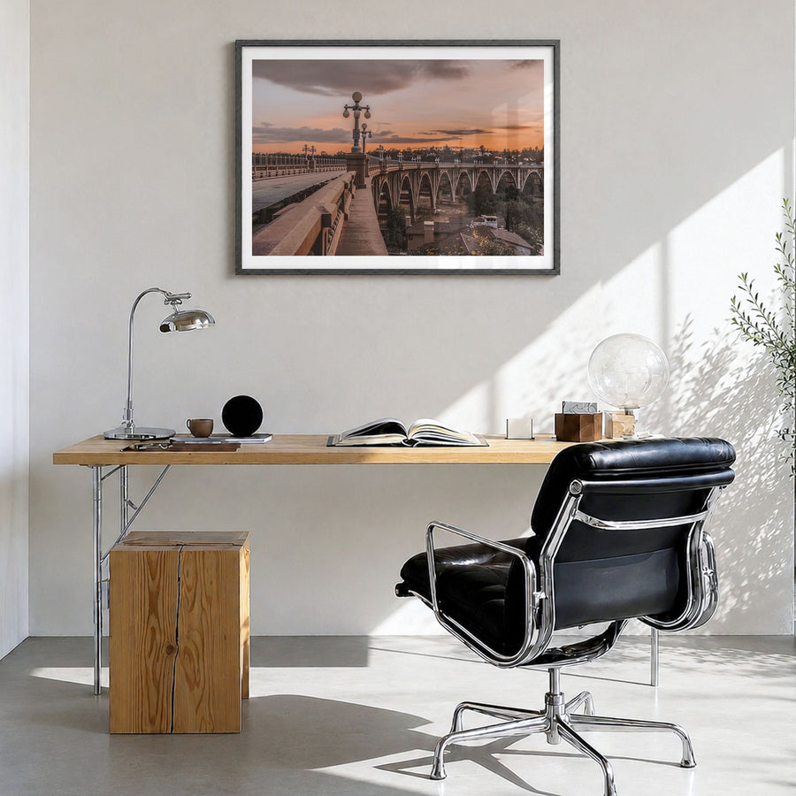 Pasadena Photo Poster in a black wood frame, hanging in a bright home office, white border