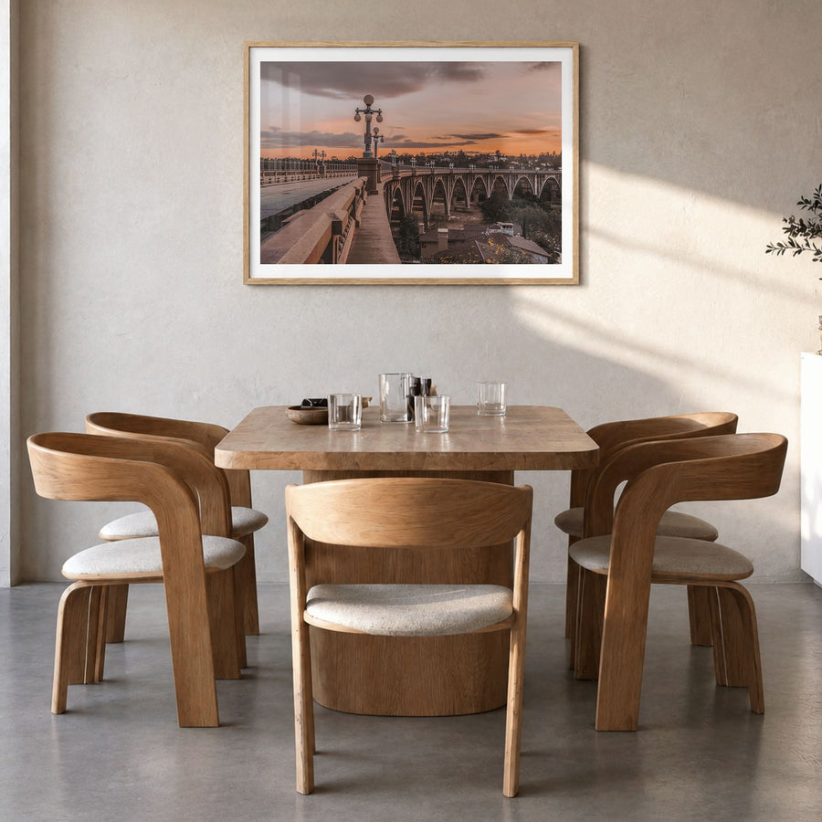 Pasadena Photo Poster in a natural wood frame, hanging in a dining room, white border