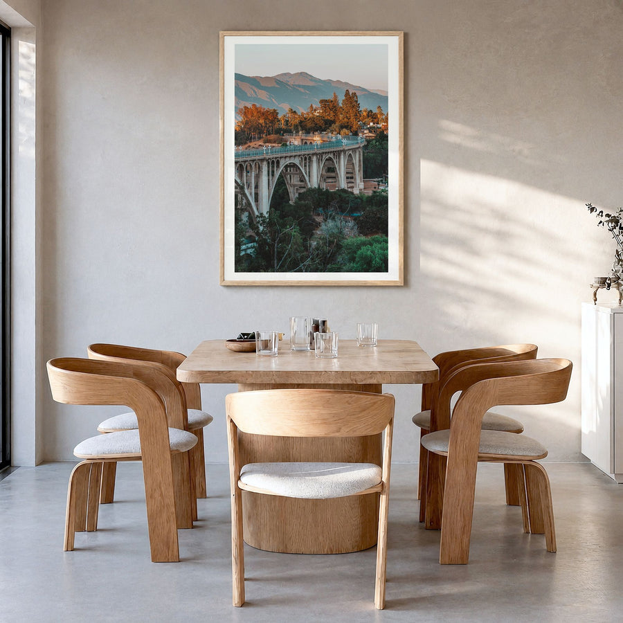 Pasadena Photo No 2 Poster in a natural wood frame, hanging in a dining room, white border
