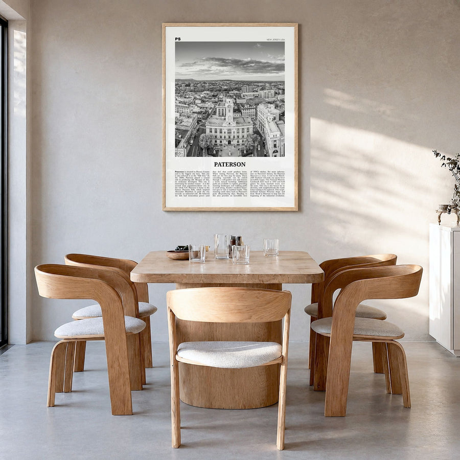 Paterson Newspaper Poster in a natural wood frame, hanging in a dining room