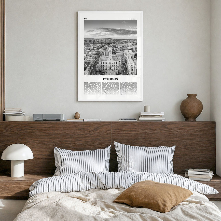 Paterson Newspaper Poster in a white wood frame, hanging in a bedroom