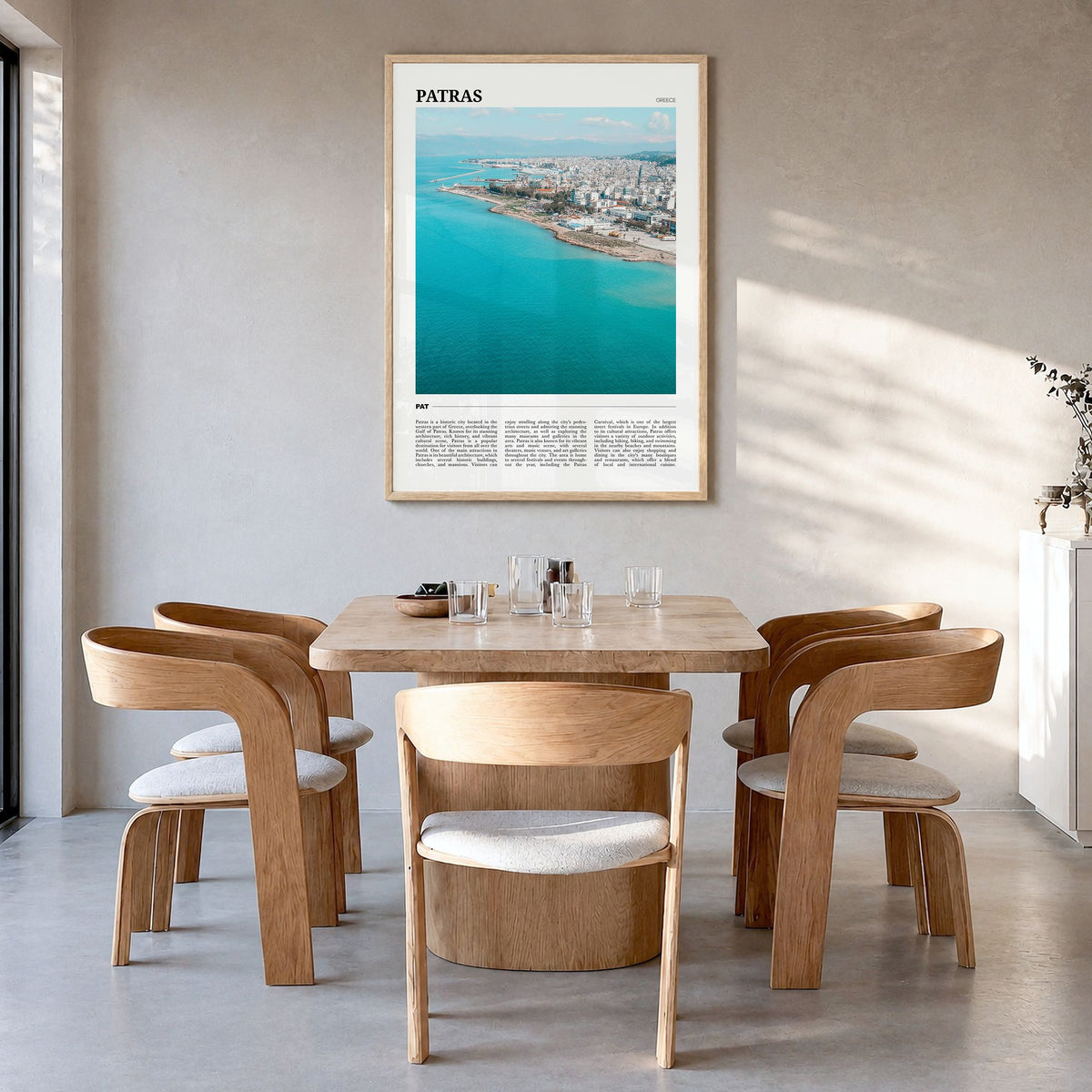 Patras Travel Poster in a natural wood frame, hanging in a dining room