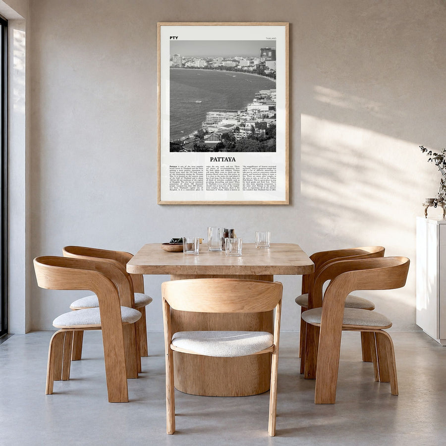 Pattaya Newspaper Poster in a natural wood frame, hanging in a dining room