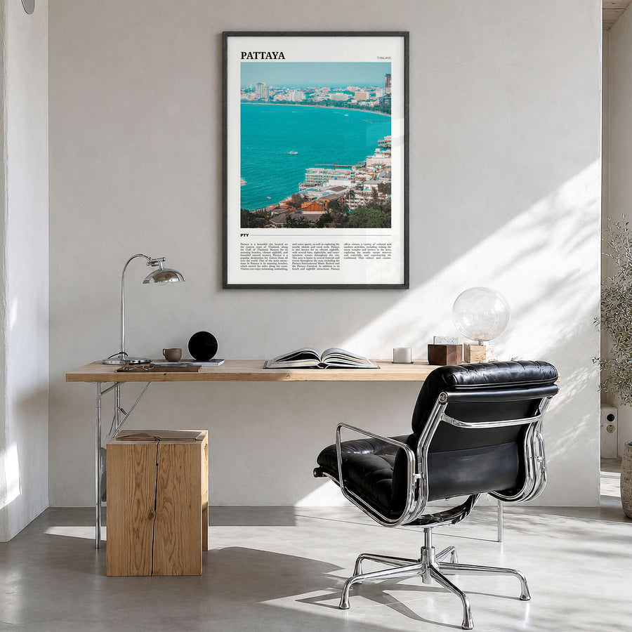 Pattaya Travel Poster in a black wood frame, hanging in a bright home office