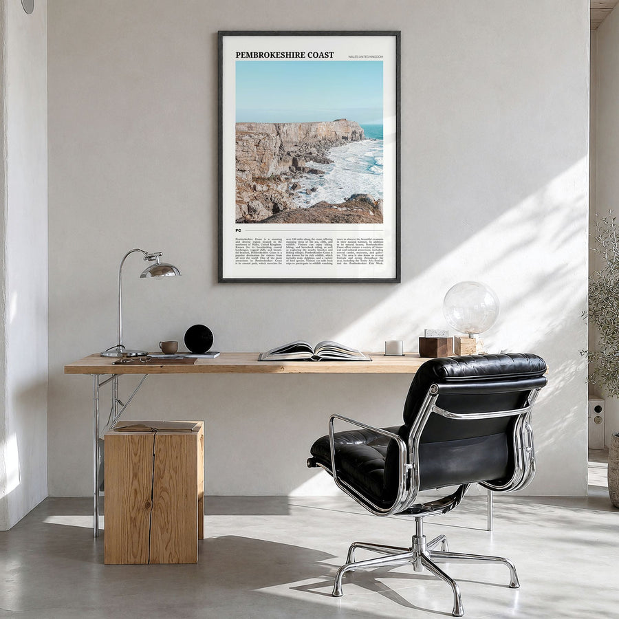 Pembrokeshire Coast Travel Poster in a black wood frame, hanging in a bright home office
