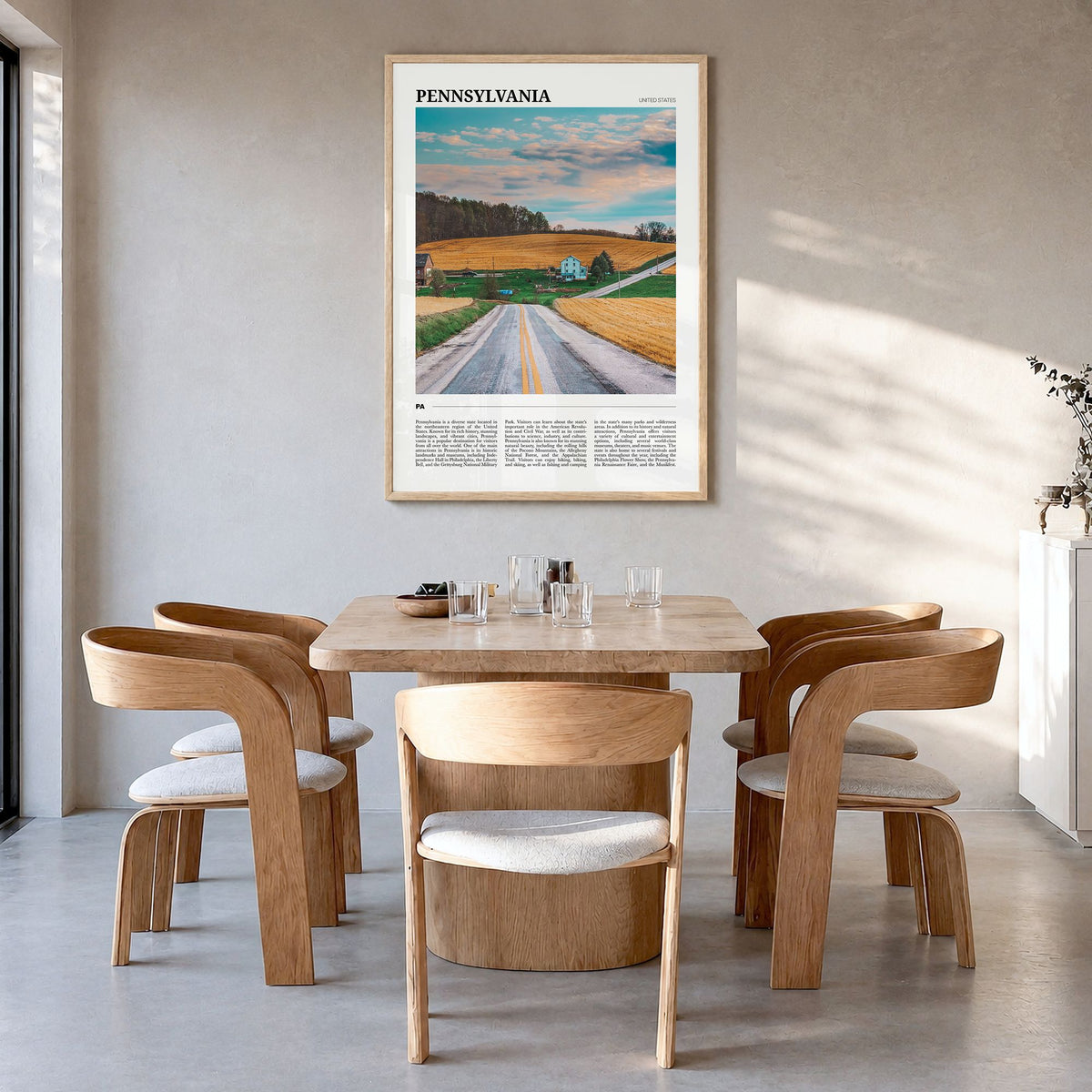 Pennsylvania Travel Poster in a natural wood frame, hanging in a dining room