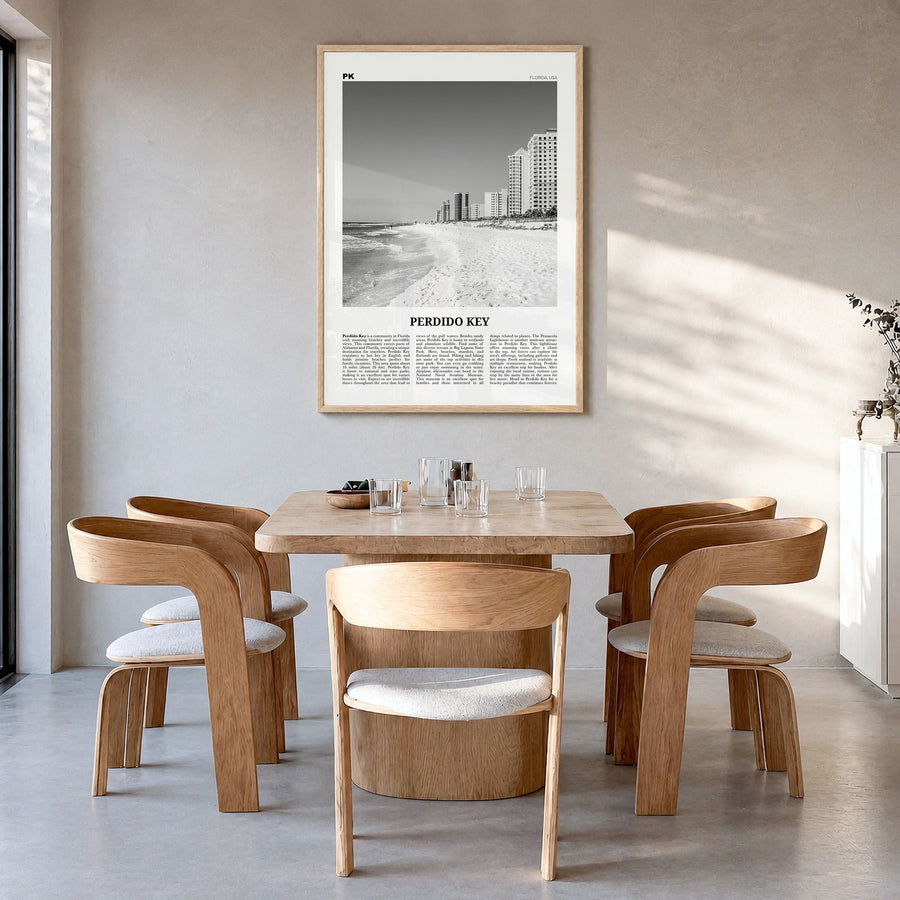 Perdido Key Newspaper Poster in a natural wood frame, hanging in a dining room