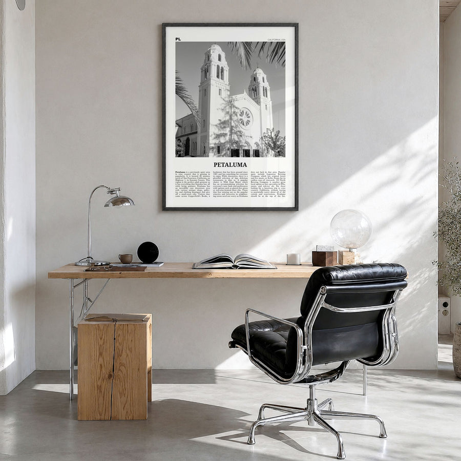 Petaluma Newspaper Poster in a black wood frame, hanging in a bright home office