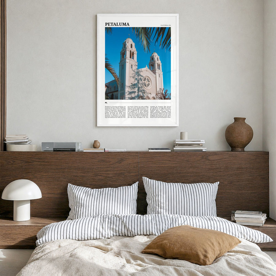 Petaluma Travel Poster in a white wood frame, hanging in a bedroom