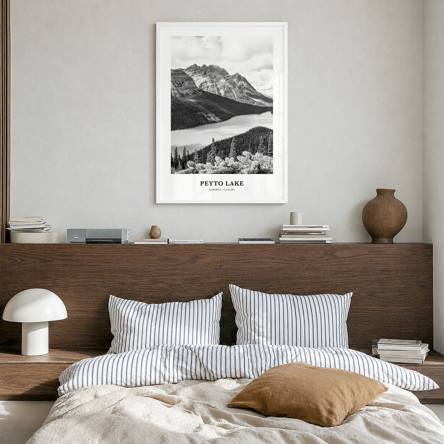 Peyto Lake Classic Poster in a white wood frame, hanging in a bedroom