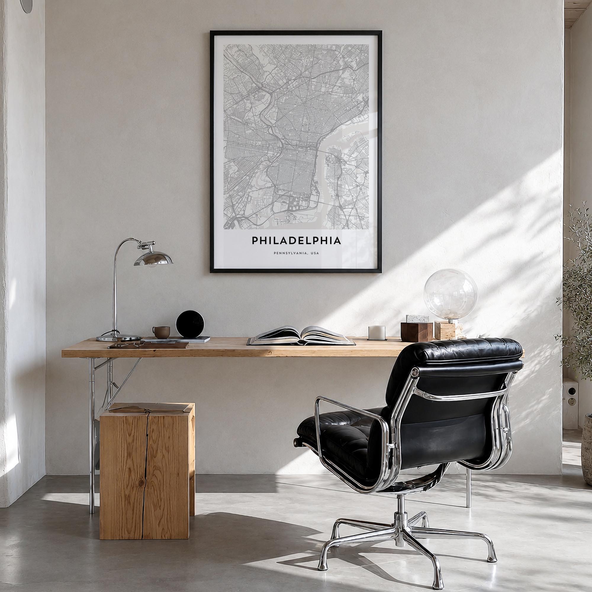 Philadelphia black & white map poster of Pennsylvania, USA – vertical wall art in black wood frame, hanging on wall
