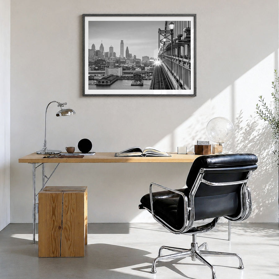 Philadelphia Photo Poster in a black wood frame, hanging in a bright home office, white border