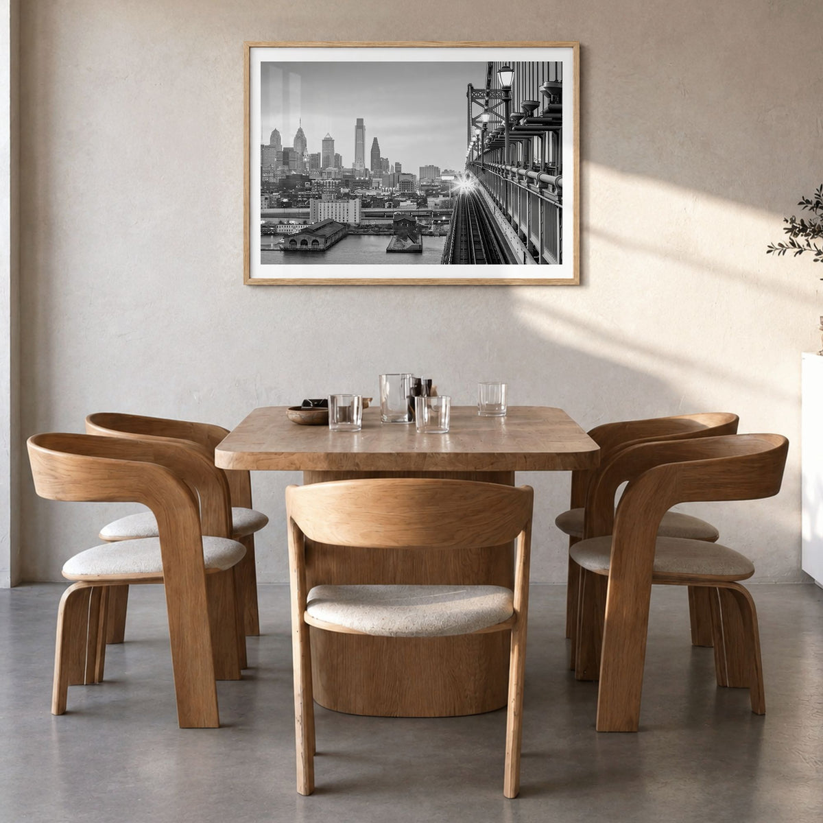 Philadelphia Photo Poster in a natural wood frame, hanging in a dining room, white border