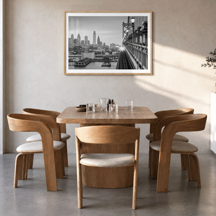 Philadelphia Photo Poster in a natural wood frame, hanging in a dining room, white border