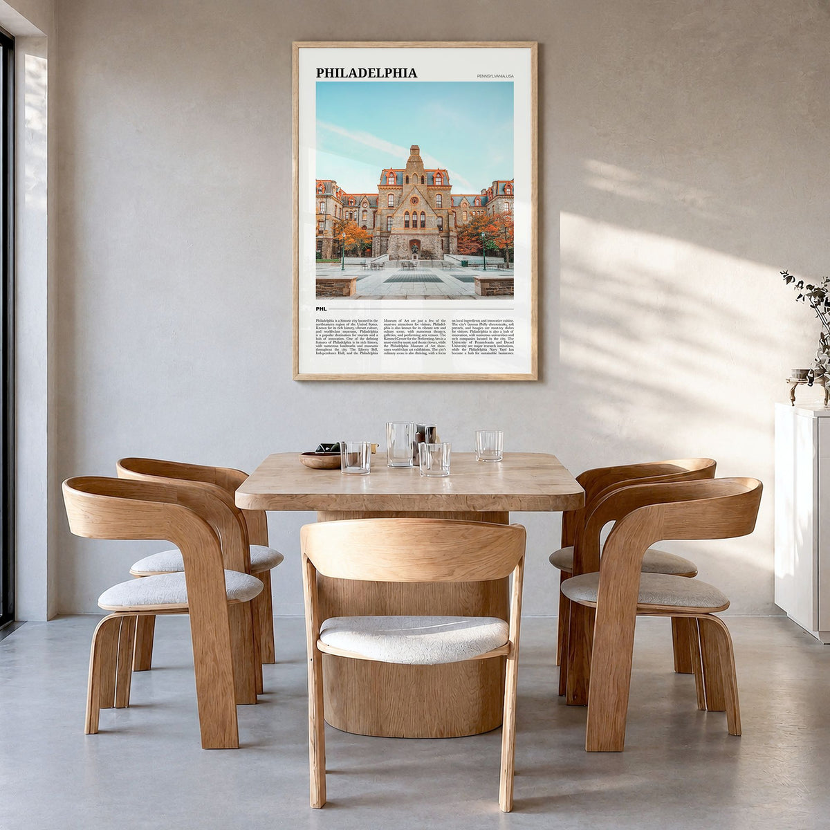 Philadelphia Travel No 1 Poster in a natural wood frame, hanging in a dining room