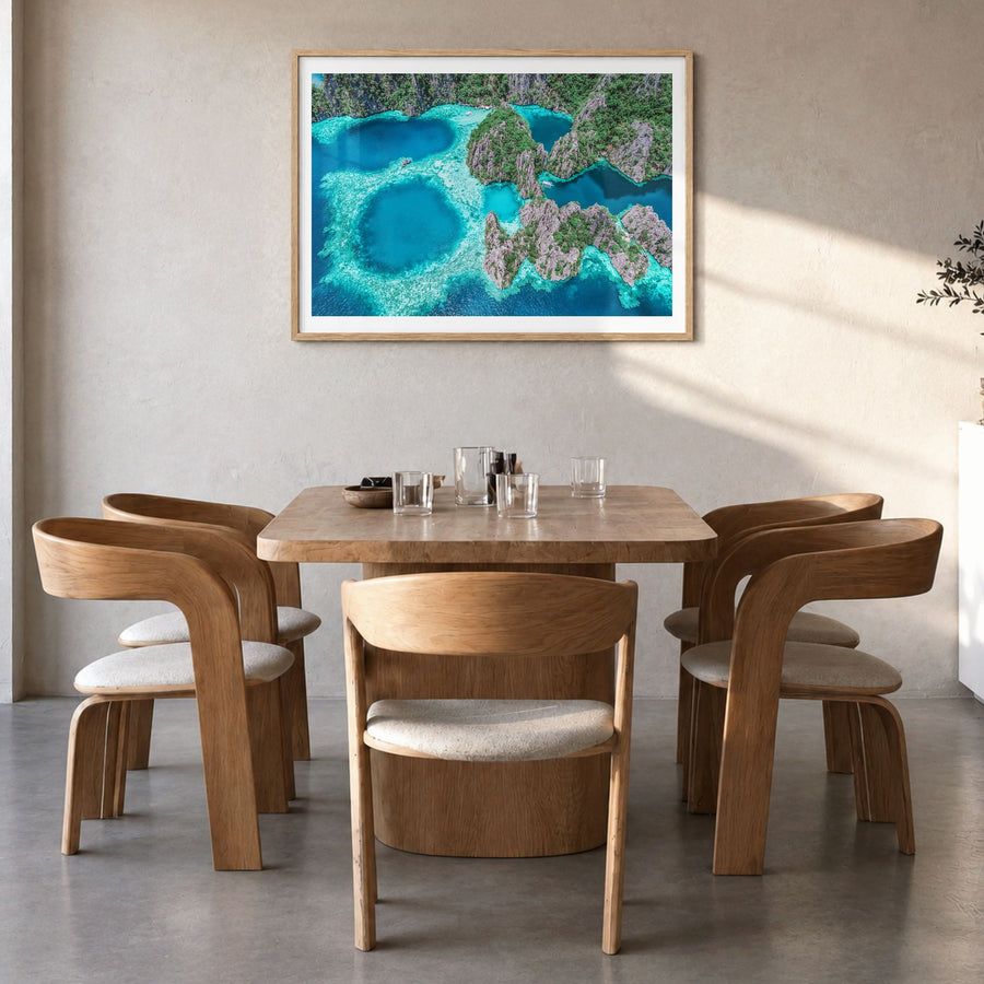 Philippines Photo Poster in a natural wood frame, hanging in a dining room, white border