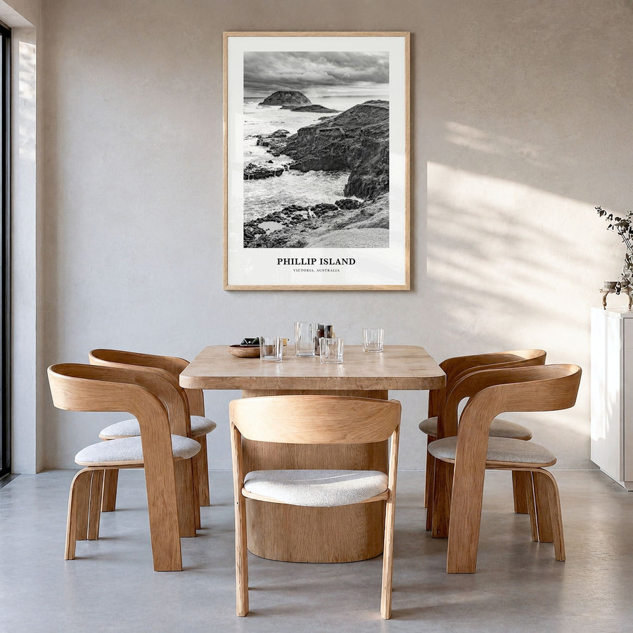 Phillip Island Classic Poster in a natural wood frame, hanging in a dining room