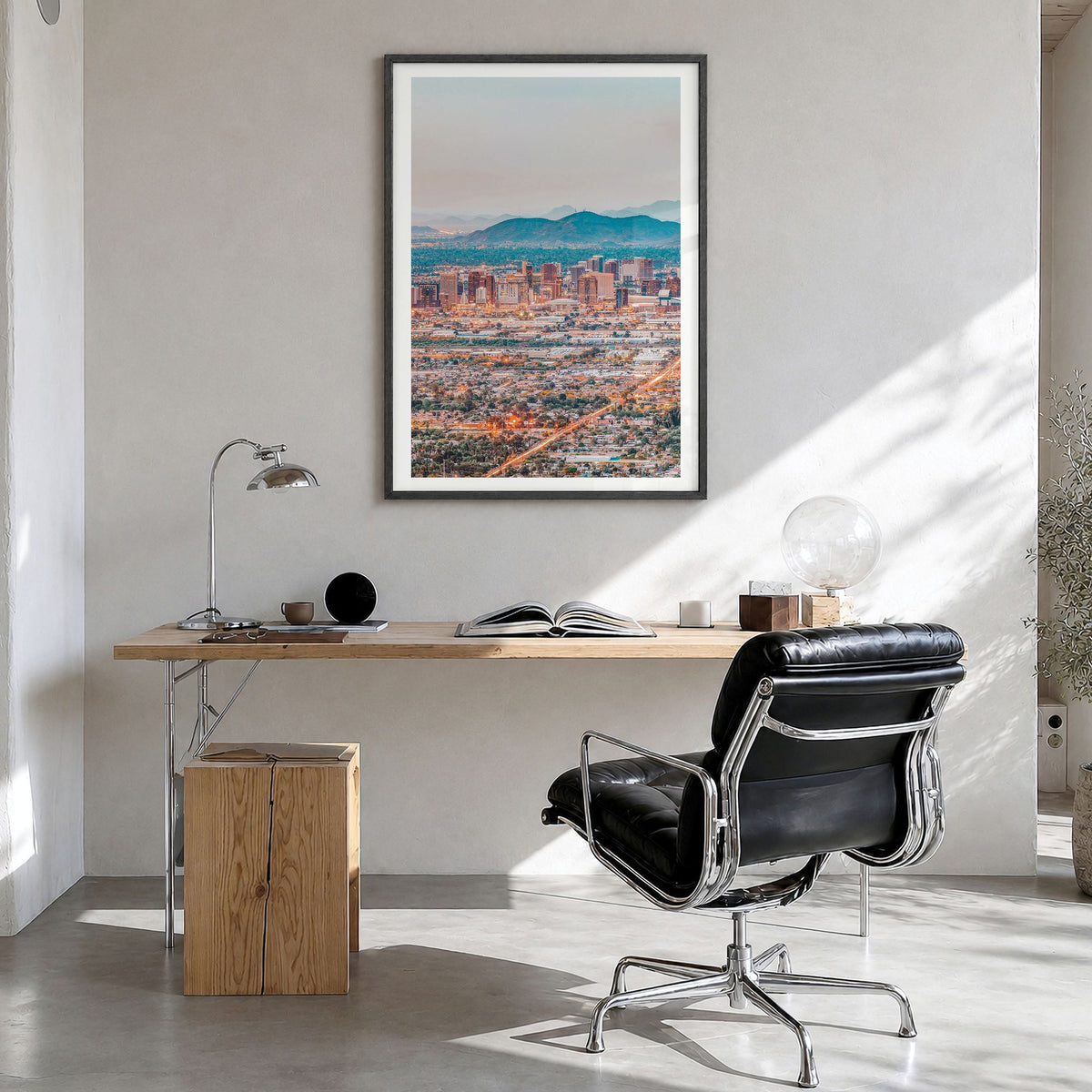 Phoenix Photo Poster in a black wood frame, hanging in a bright home office, white border