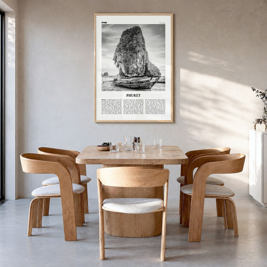 Phuket Newspaper Poster in a natural wood frame, hanging in a dining room