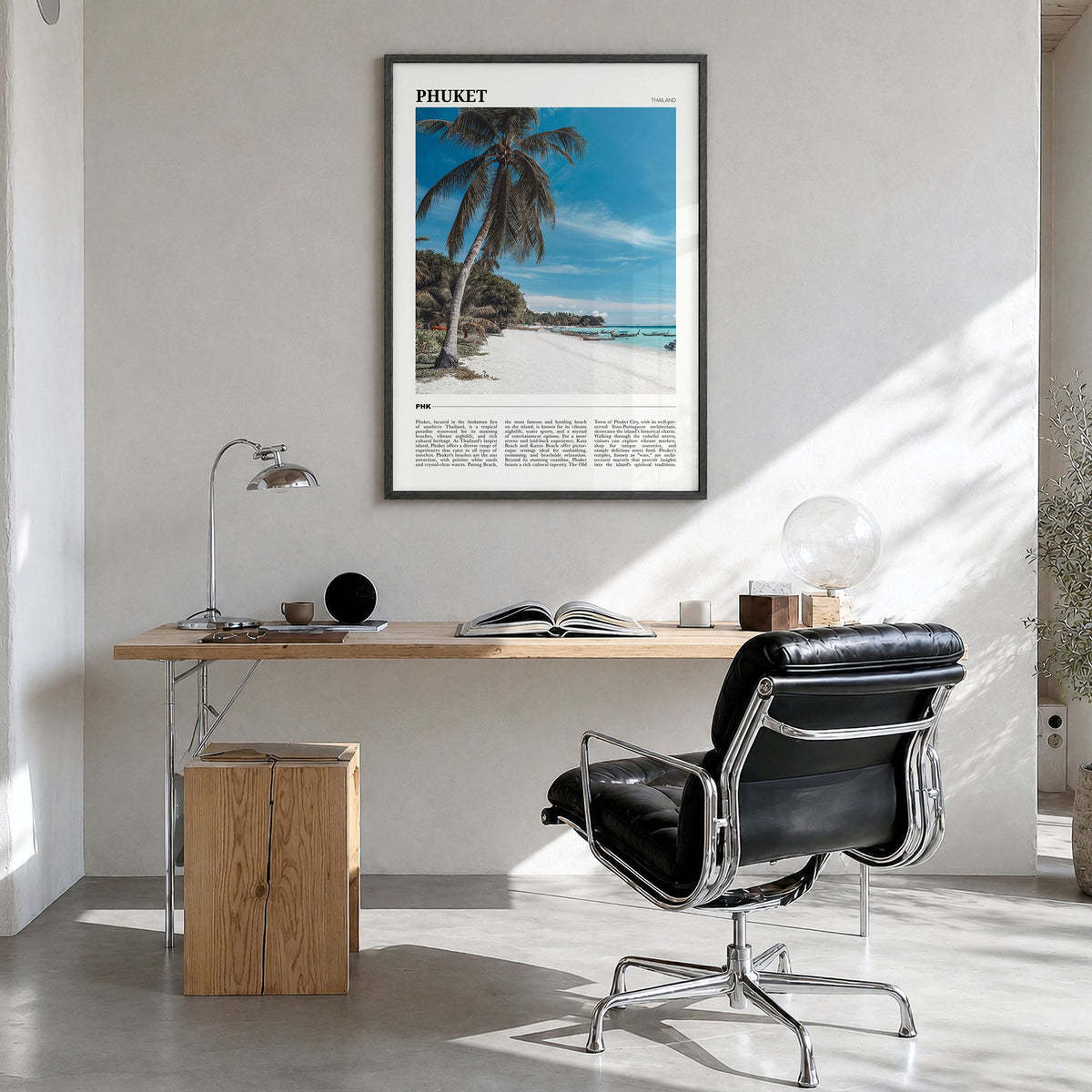 Phuket Travel Poster in a black wood frame, hanging in a bright home office