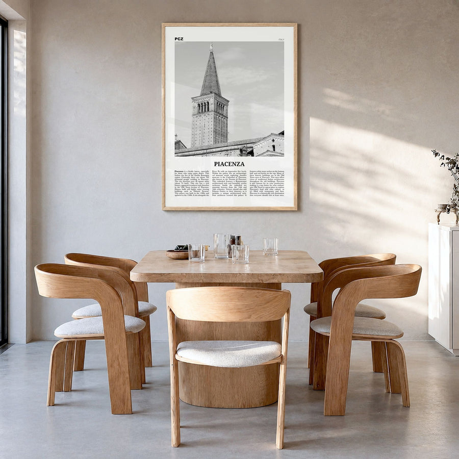 Piacenza Newspaper Poster in a natural wood frame, hanging in a dining room
