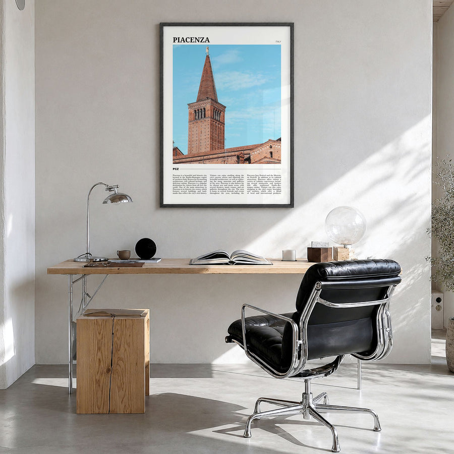 Piacenza Travel Poster in a black wood frame, hanging in a bright home office