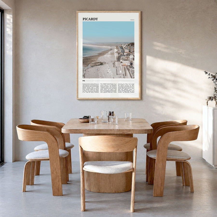 Picardy Travel Poster in a natural wood frame, hanging in a dining room