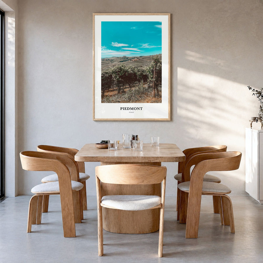 Piedmont Classic Poster in a natural wood frame, hanging in a dining room