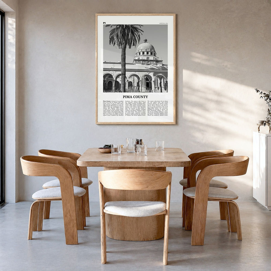 Pima County Newspaper Poster in a natural wood frame, hanging in a dining room