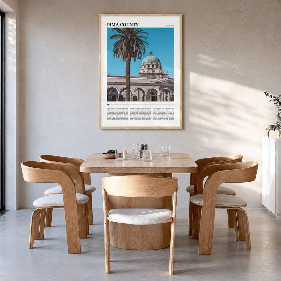 Pima County Travel Poster in a natural wood frame, hanging in a dining room