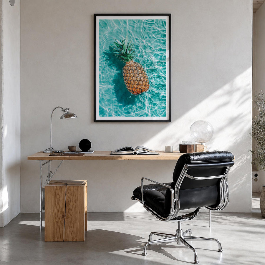 Pineapple no. 1 colorful photo poster – vertical wall art in black wood frame with white border, hanging on wall